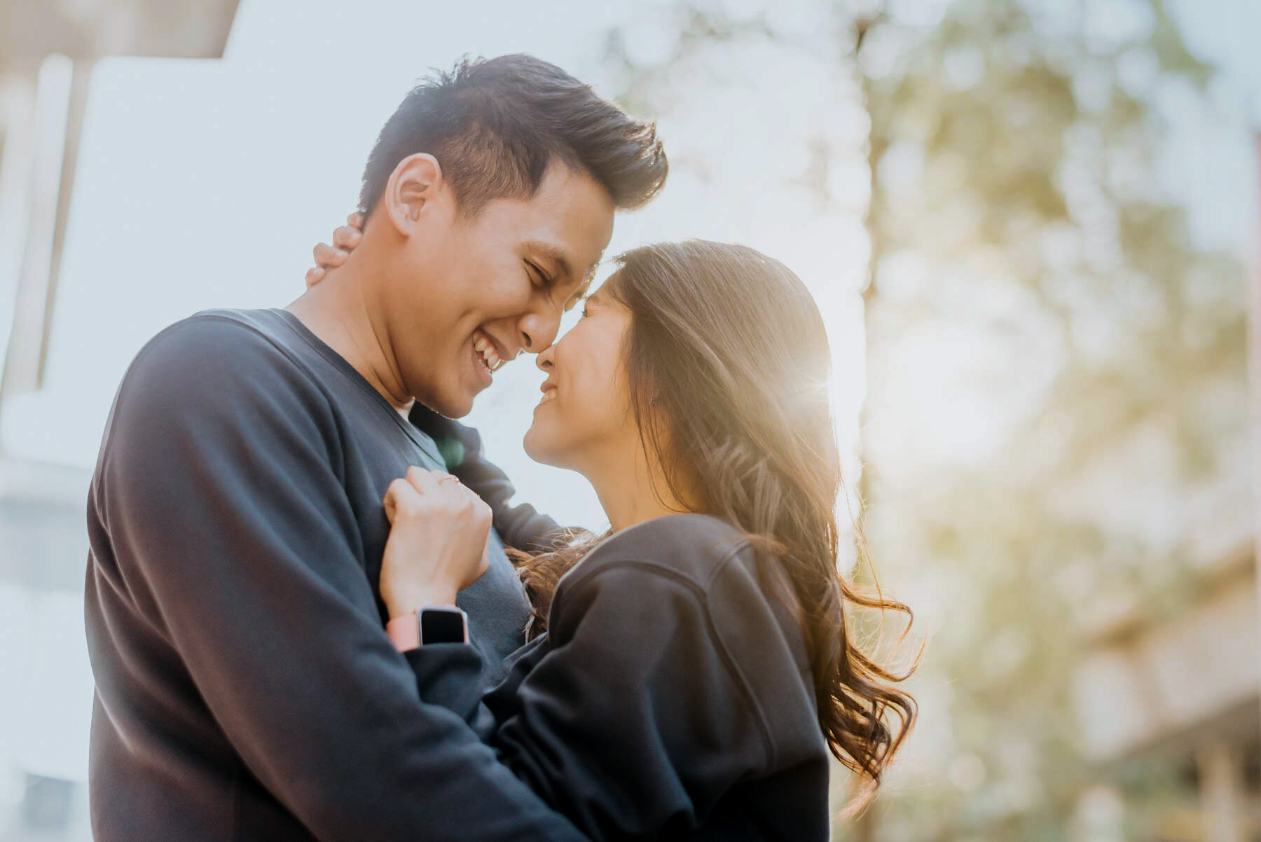 Smiling couple embracing outdoors